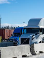 Trucks line up to go through the new gate complex at Terminal 5 in Seattle. The modernized gate complex doubles the on-terminal truck queuing capacity at Terminal 5. 